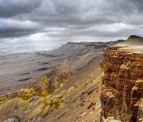Panoramic view of the stony slope of a desert canyon.