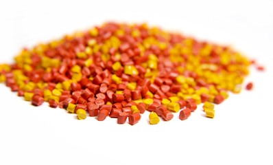 Colorful plastic polymer granules isolated on white 