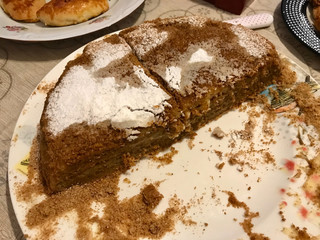 Homemade Russian Medovik Cake with Honey, Cinnamon and Powdered Sugar.