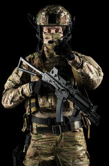 Soldier holding assault rifle. Uniform conforms to special services of the Russian Federation. Shot...