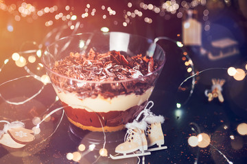 Pot of Irresistible Layered Billionaires Dessert made from mousse, Belgian chocolate sauce, and...