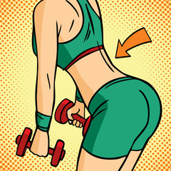 Close-up of the torso of women holding dumbbells. The arrow points to the torso muscles. Muscular fitness woman doing exercises. Concept of a healthy lifestyle.