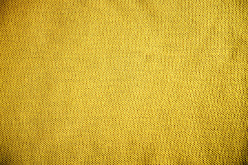 Obraz premium Yellow fabric texture, vintage background, macro shot.