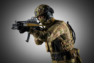 Soldier holding assault rifle. Uniform conforms to special services of the Russian Federation. Shot...