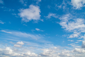 Background with blue sky with lots of white clouds