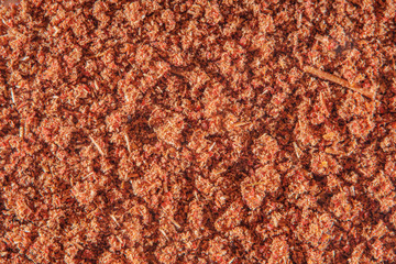 Background with scattered ground cinnamon at high magnification