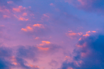 Naklejka na ściany i meble Pink dawn in the sky with clouds