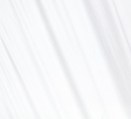 Fototapeta premium White factory fabric as an abstract background.