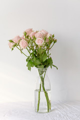 Flowers in a glass vase on the table