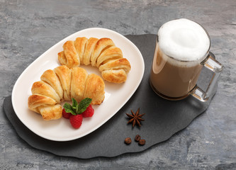 Handmade pineapple croissants and cappuccino for Breakfast. 