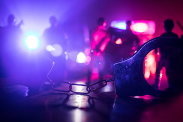 Police cars at night. Police car chasing a car at night with fog background. 911 Emergency response police car speeding to scene of crime. Selective focus