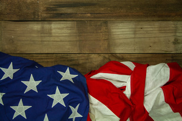 Ruffled American Flag on Wood Background