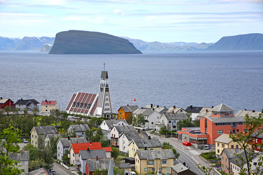 Town of Hammerfest with the cathedral, mountains & fjords in the background. Hammerfest is the northernmost town in the world with more than 10,000 inhabitants, county, Norway.