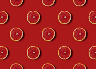 Grapefruit on red  background. Healthy eating.