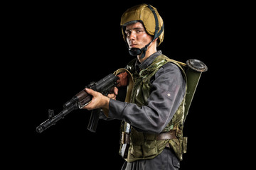 Fototapeta premium Male in uniform conforms to Russian army special forces (OMON)&nbsp;in War in Chechnya. Isolated on black backgroundx