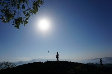 Silhouette of a man on a mountain
