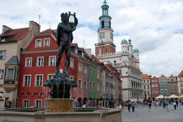 Poznan Poland, Streetscape of Market square with Fountain of Apollo and row of colorful houses 