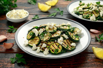 Warm salad with grilled zucchini, garlic and herbs