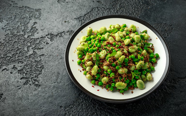 Vegan Green broad beans and quinoa salad with sweet peas and mint. Healthy food.