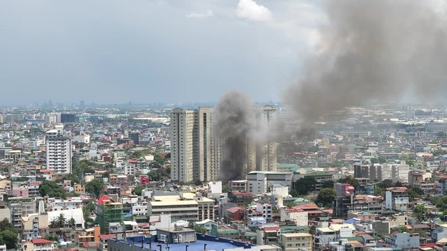 Fire hits squatter area in Pasay - Philippines May 17, 2020. Video is taken from one of high rise condo building in Makati city of Manila - Philippines
