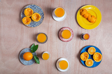 Homemade orange juice from above on wooden table