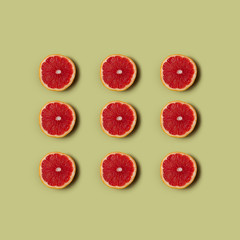 Grapefruit on green background. Healthy eating.