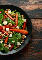 Poster Roasted carrot salad with feta cheese, walnut and spinach. healthy food © grinchh