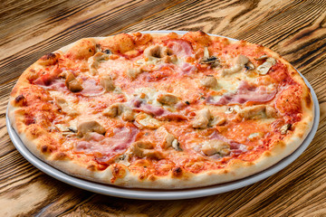 Italian pizza on a thin dough with a variety of stuffed. Mixed media