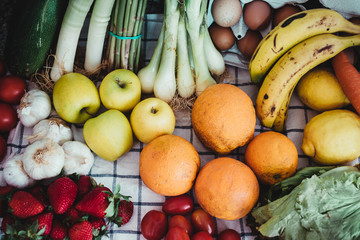 organic fruits and vegetables on a tablecloth