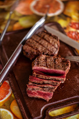 Delicious juicy grilled beef steak on a cutting board