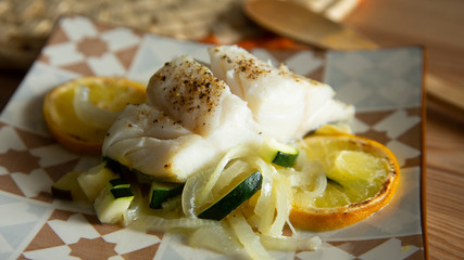 Cod fish with lemon and zucchini 