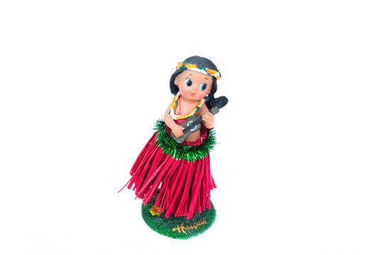 a hula girl doll with ukulele on the white background.