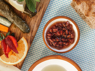 Top view of pomegranate jam on breakfast table, pomegranate jam on wooden table