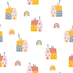 Colored cartoon houses and rainbows  isolated on white backdrop. Scandinavian style seamless pattern. Hand-drawn kid's print for textile, wallpaper, wrapping paper, background flat design.