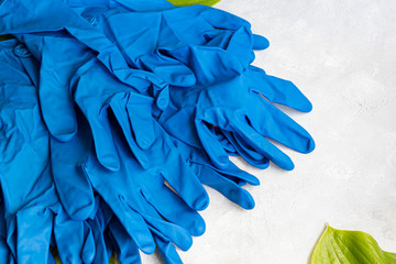 Disposable gloves for cleaning, and against the virus. On a gray background.