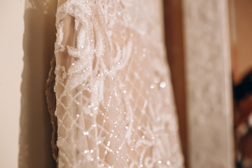 white bride's dress. Detail of the dress close-up. The dress on a hanger.
