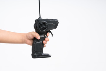 Kid hand holding controller remote with trigger and turn wheelbackground
