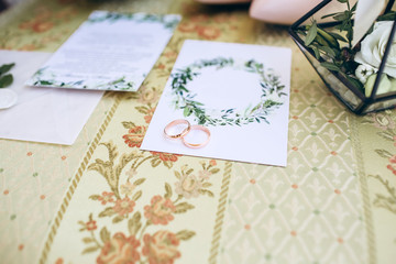 bride's bouquet, shoes, wedding rings and a set of invitations. The bride's accessories. Wedding morning.