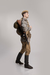 Actor man in an old military uniform and camouflage clothing of a soldier of the Soviet army during...