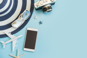 Travel accessories items with smartphone on color background and copy space, Summer vacation concept
