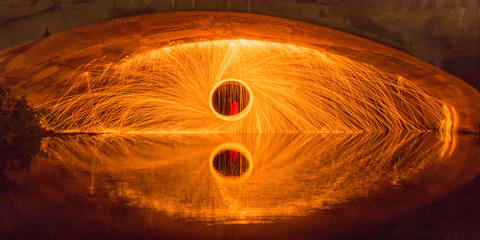 Whirl of sparks and flames under the blue bridge of Tuebingen, Germany - 1