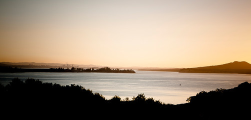 Auckland bay and cityscape from Waiheke Island, dusk. New Zealand