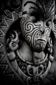 Maori traditional carving outside Marae. Ta moko. New Zealand. 