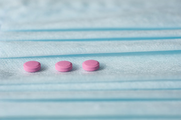 These are Tablets and Disposable medical Masks. Macro Photo. Pharmaceuticals And Medicine.