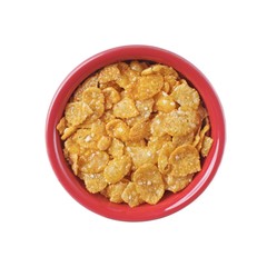 Cornflakes in a red bowl Isolated on white background. Top view.