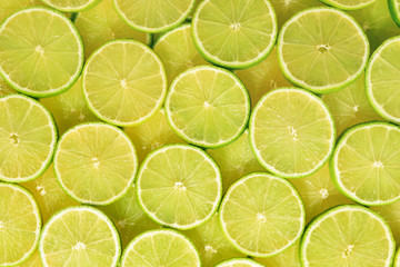 Fresh lime slices as a background.