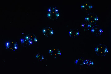 Soap bubbles isolated on a black background. Copy space.