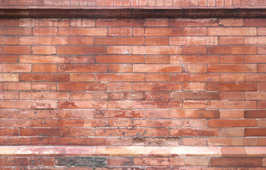 dirty wall background texture with ancient bricks and irregular tones of orange, red and brown, framed up and down - wallpaper