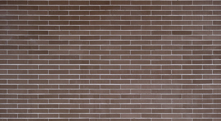 big brick wall with dark brown or garnet color - regular and well aligned bricks background wallpaper
