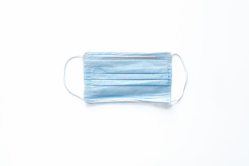 Blue medical mask to protect your health from the virus on a blue background